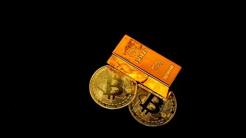 Gold bars and Bitcoin (BTC) on a black background Stock Footage 325015690