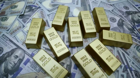 Gold Bars and US Dollar Bills Symbol of Wealth, Luxury, and Financial Secur.. Stock Footage 310586131