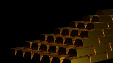 Gold bars form a precise pyramid shape. Each bar glows with metallic sheen. Warm Video stock 343911382