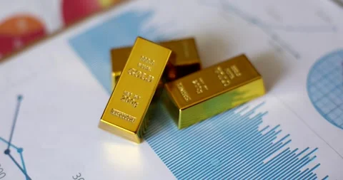 Gold bars lying on documents with graphs closeup 4k movie slow motion Vídeos de archivo 281416832