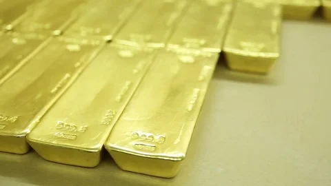 Gold biscuits arranged on the table Stock Footage 77444013