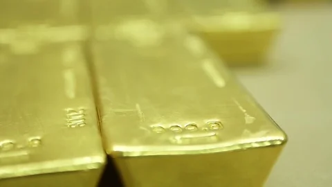 Gold biscuits kept on a surface Stock Footage 77444027