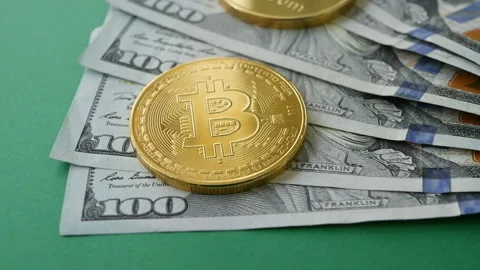 Gold Bit Coin BTC, ETC coins rotating on 100 dollars bills on green backgrounds Stock Footage 88871231