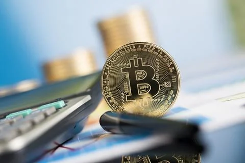 Gold Bitcoin on the background of the chart Stock Photos