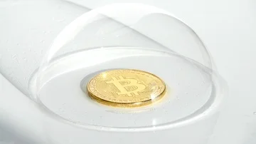 Gold Bitcoin cryptocurrency BTC coin in soap bubble being popped by needle  Stock Footage 85710666