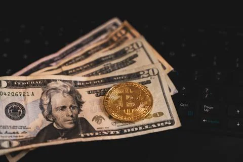 Gold Bitcoin Cryptocurrency Token on Computer Laptop Stock Photos