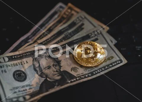 Gold Bitcoin Cryptocurrency Token on Computer Laptop Stock Photos