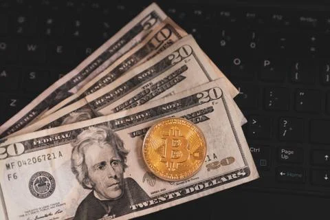 Gold Bitcoin Cryptocurrency Token on Computer Laptop Stock Photos