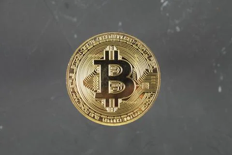 Gold bitcoin on a dark background, selective focus, copy space. Stock Photos