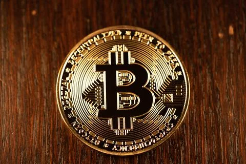 Gold Bitcoin on dark surface, Cryptocurrency and Blockchain concept Stock-Fotos