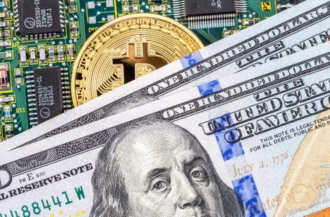 Gold bitcoin, electronic computer component and american dollar Stock Photos