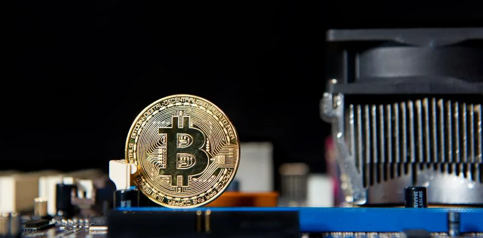 Gold Bitcoin electronic computer processor board Stock Photos