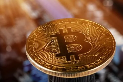 Gold Bitcoin electronic computer processor board close up 写真素材