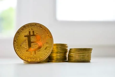 Gold bitcoin on a light background. Crypto currency. Stock Photos