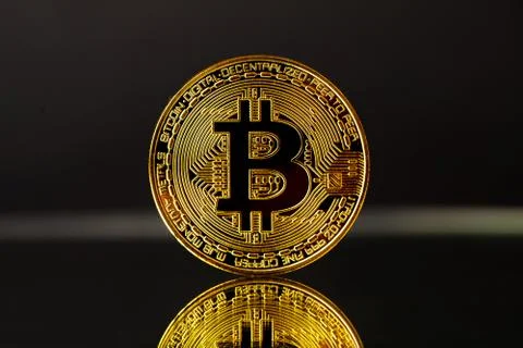 Gold Bitcoin With Reflection On Black Background Stock Photos