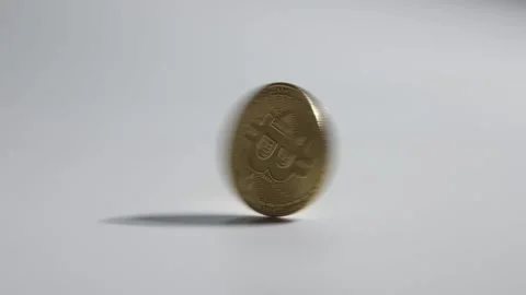 Gold bitcoin rotating solated on white background close-up. Stock Footage 156876658