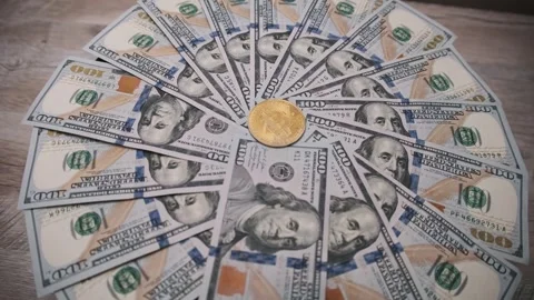 Gold Bitcoin surrounded by US Dollar fan pattern Stock Footage 303866449