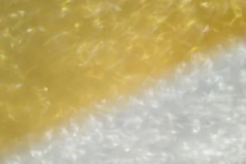 Gold blurred background. Stock Photos