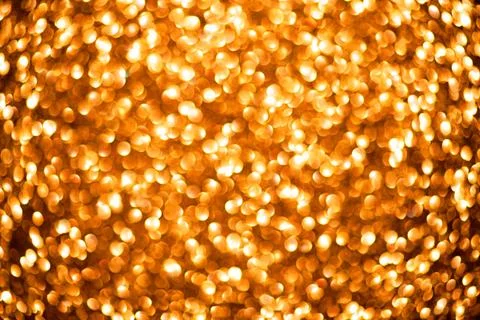 Gold bokeh background for creative banner. Golden bokeh on shiny texture. G.. Stock Photos