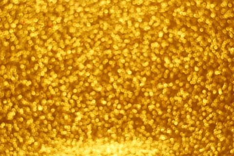 Gold bokeh background Stock Photos
