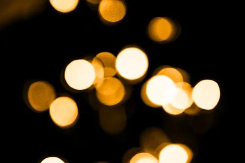 Gold bokeh defocused light. Christmas twinkling lights background bokeh Stock Photos