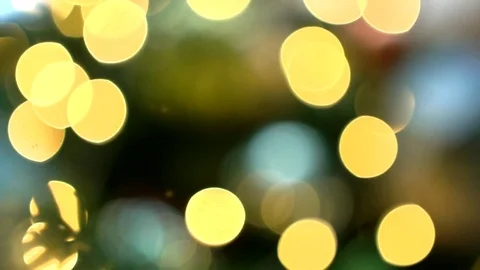 Gold bokeh effect on christmas tree decorated with christmas tree toys, close-up Video stock 83566465