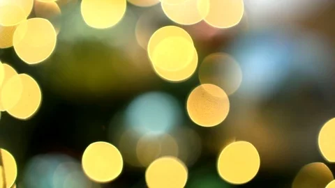 Gold bokeh effect on christmas tree decorated with christmas tree toys, close-up 스톡 동영상 83566471