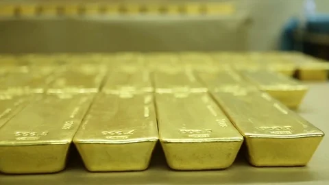 Gold bricks laid on the table Stock Footage 77444024