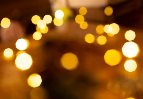 Gold bright lights with dark deep background. bokeh style. Stock Photos