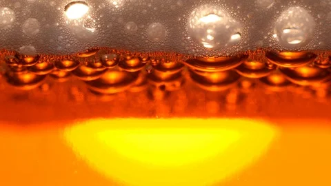 Gold bubbles in the appetizing drink Stock Footage 119944543