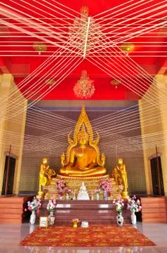 Gold buddha image with holy thread in wat phai lom Stock Photos