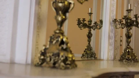 Gold candlestick close up. Gold Candlestick Old gorgeous wooden cupboard. Two Stock Footage 83186185