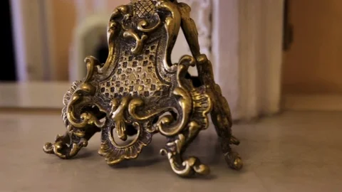 Gold candlestick close up. Gold Candlestick Old gorgeous wooden cupboard. Two Stock Footage 83186197