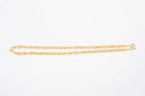 Gold chain necklace isolated on white background. Stock Photos