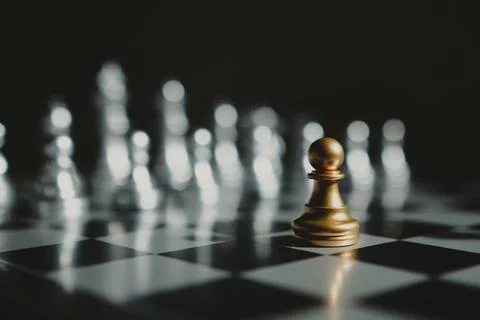 Gold chess piece encounter silver chess piece. Stock Photos