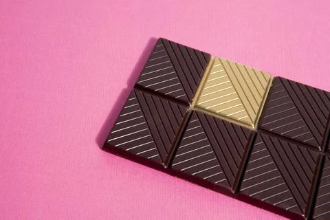 Gold chocolate white background Stock Photos