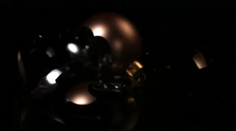 Gold Christmas Ornament Shatters On Black Background In Slow Motion Stock Footage 59669604