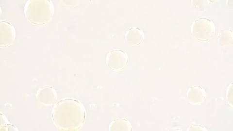Gold Clear Bubbles Form and Float to Another Ones on Transparent Surface on Stock Footage 274636610