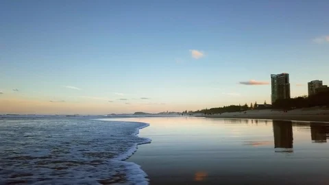 GOLD COAST BEACH SUNSET LOW DRONE ORBITING OVER WAVE Stock Footage 87699850