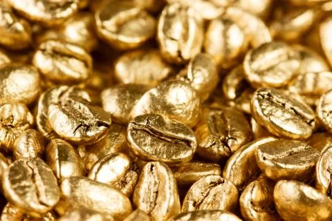 Gold coffee beans Stock Photos
