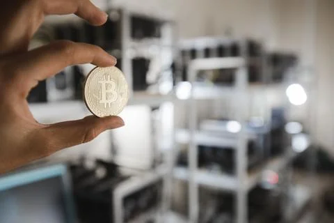 Gold coin on the background of computer devices Stock Photos