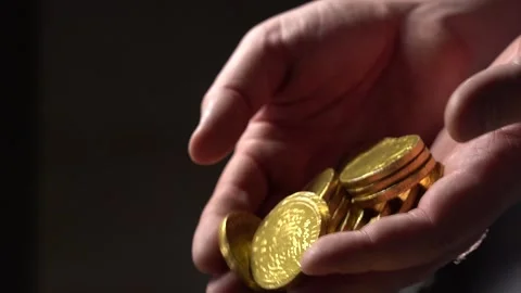 Gold Coins fall from the man's palms Stock Footage 146642816