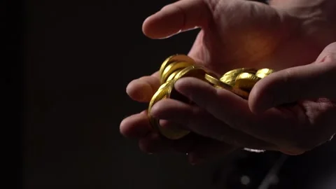 Gold Coins fall from the man's palms Stock Footage 156936108