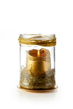 Gold colored candle Stock Photos
