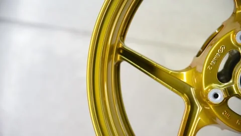 Gold colored motorcycle wheel Stock Footage 152649375