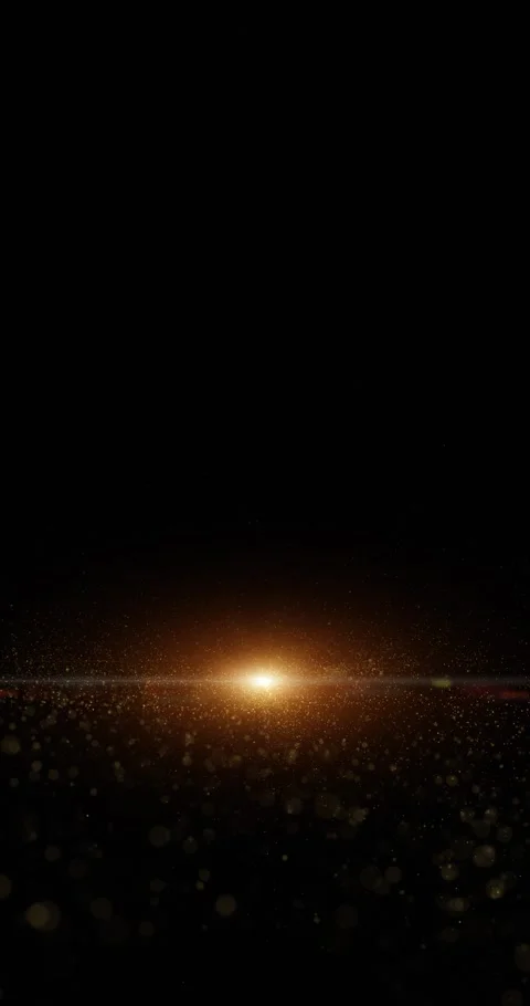 Gold colored particles loop rotation on clean black background with lens fla Stock Footage 346649174
