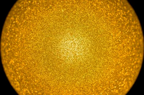 Gold colored sphere centered Stock Photos