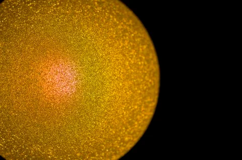 Gold colored sphere on the left Stock Photos