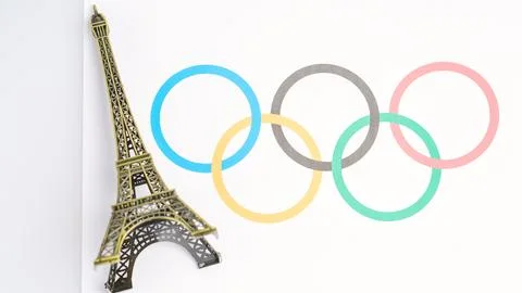 A gold colored statue of the Eiffel Tower sits on top of a white background with Foto stock