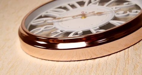 Gold-colored wall clock with large numbers Stock Footage 143124345